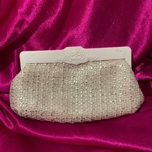 Mac cosmetic/wallet case.Hard plastic framed closure silver and cream coloured